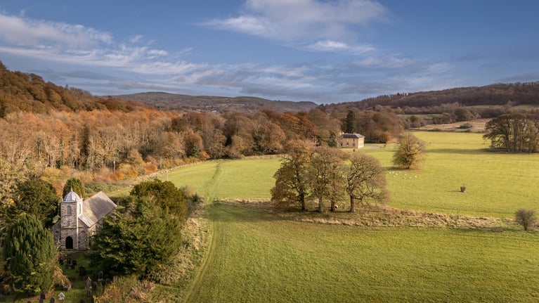 An aerial view of the Llanerchaeron estate with the Georgian Villa in the centre, near Abermydyr and Pontbrenmydyr cottages, Ceredigion